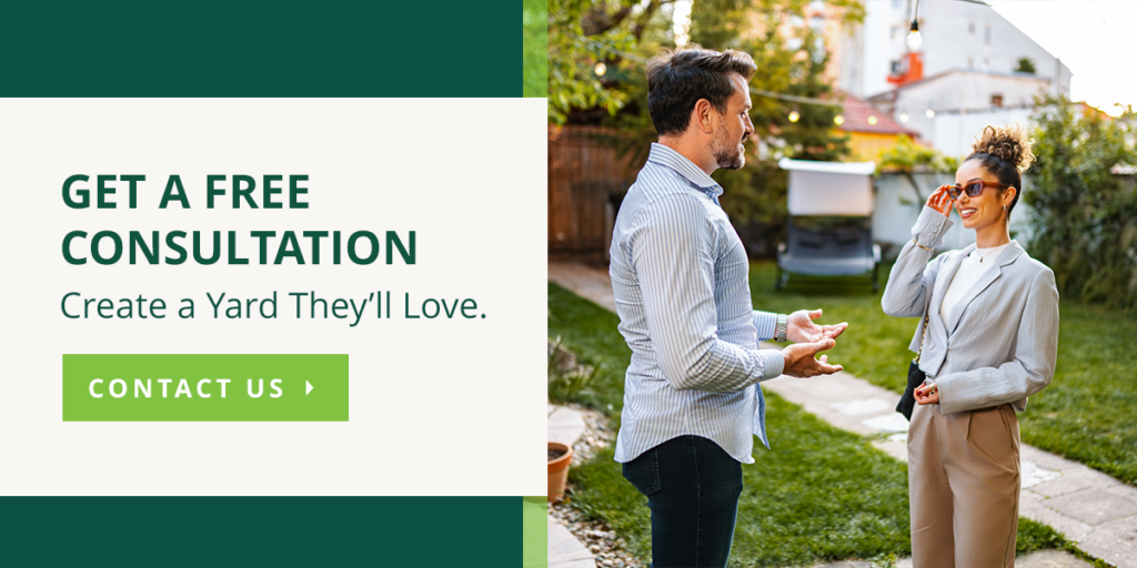 Couple discussing landscaping in their backyard